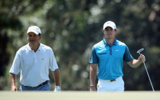 Knox and McIlroy walk the fairway