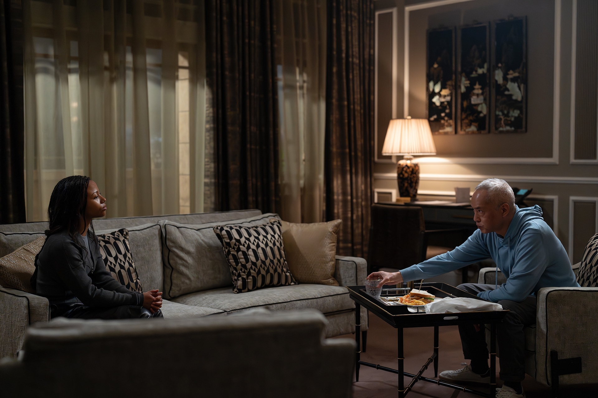 myha-la and ken leung in an episode of industry