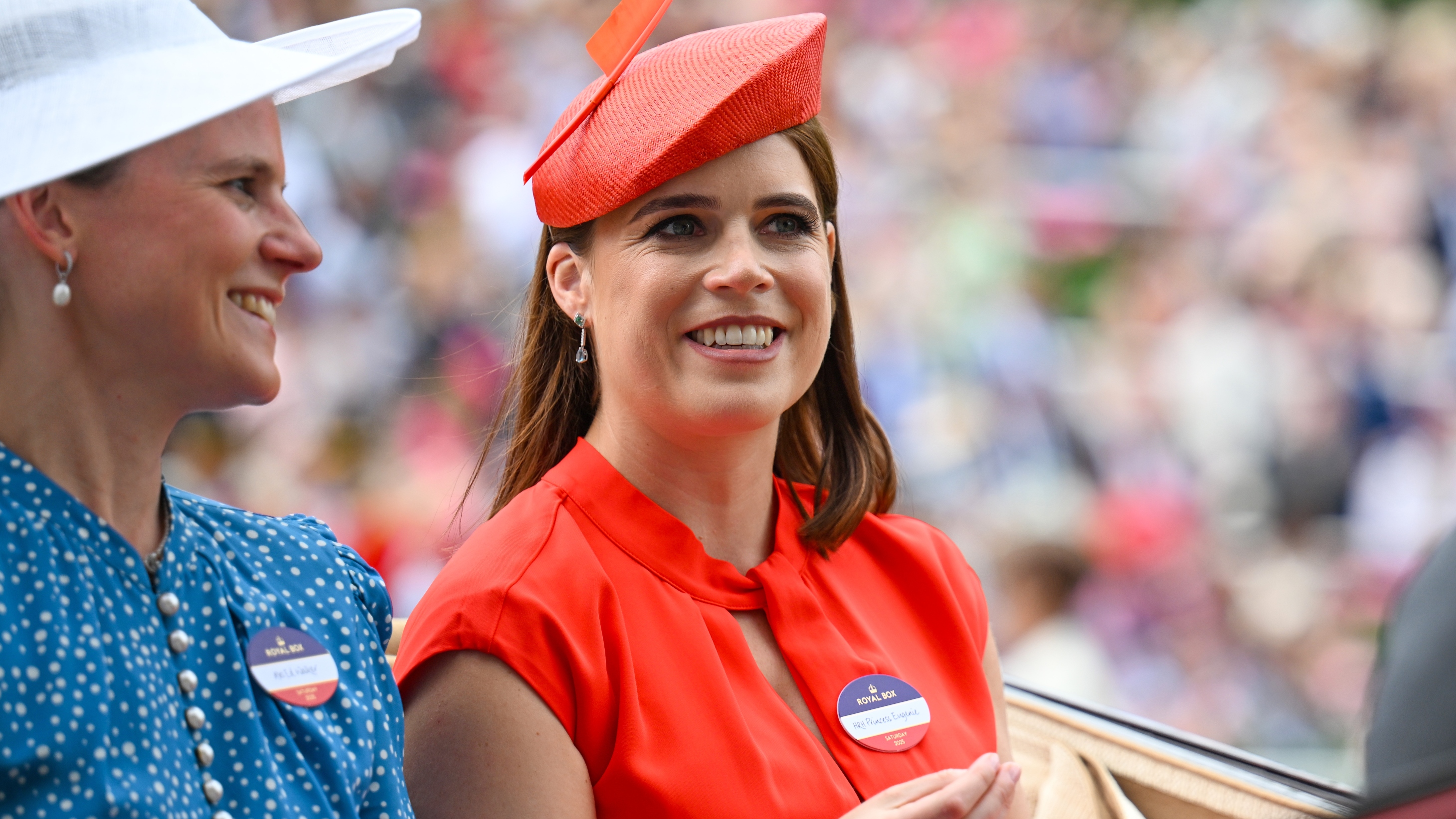 Camilla Walker and Princess Eugenie of York ride in a carriage as they attend day five of Royal Ascot 