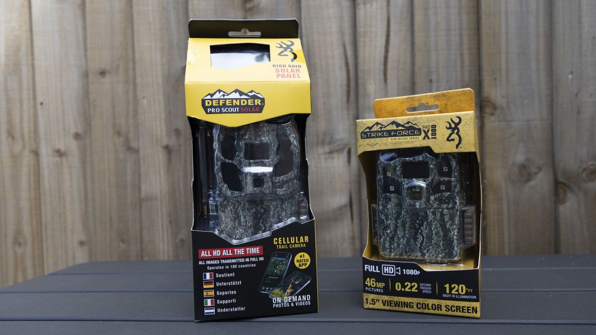 The Browning Defender Pro Scout Max Solar in its box next to the Strike Force Pro HD