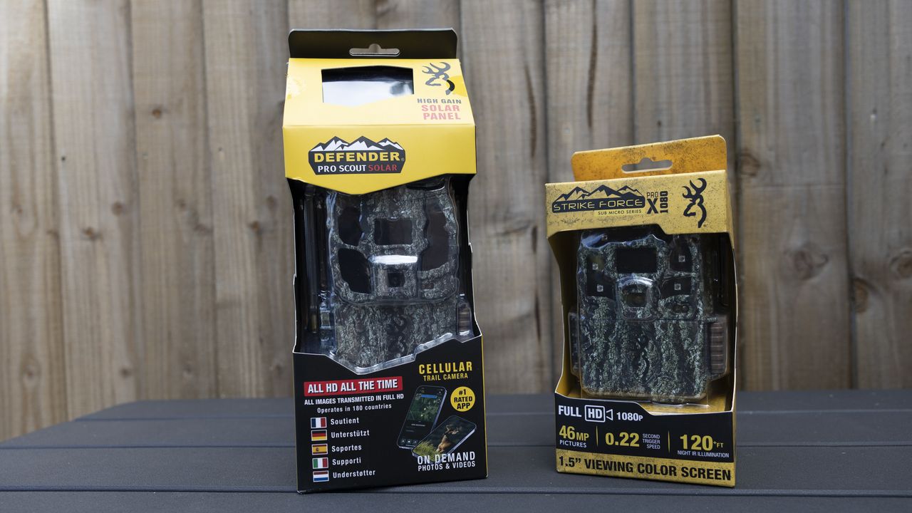 The Browning Defender Pro Scout Max Solar in its box next to the Strike Force Pro HD