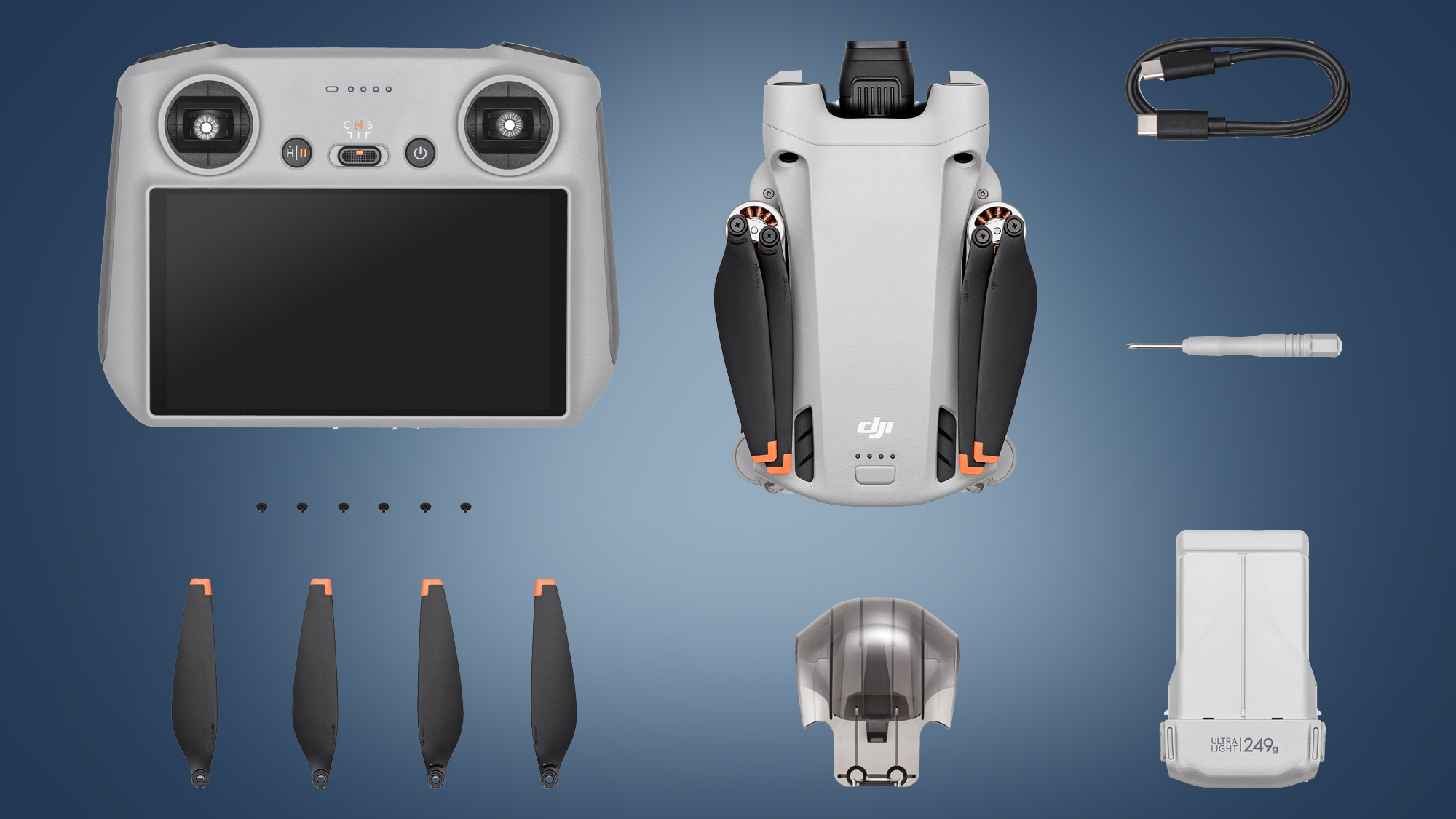 Drone DJI Mini 3 Pro di sebelah pengontrol dan aksesorinya