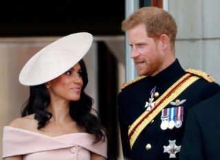 Meghan, Duchess of Sussex and Prince Harry, Duke of Sussex stand on the balcony of Buckingham Palace