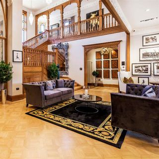 living room with rug on floor and sofaset with cushions