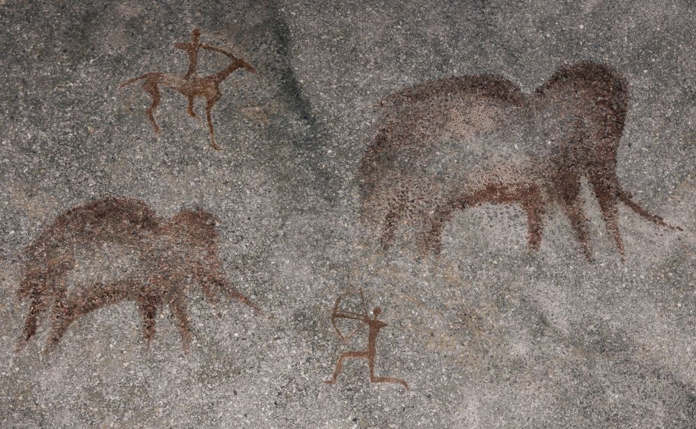 A rock painting, which is not part of the current study, showing mammoth hunters.