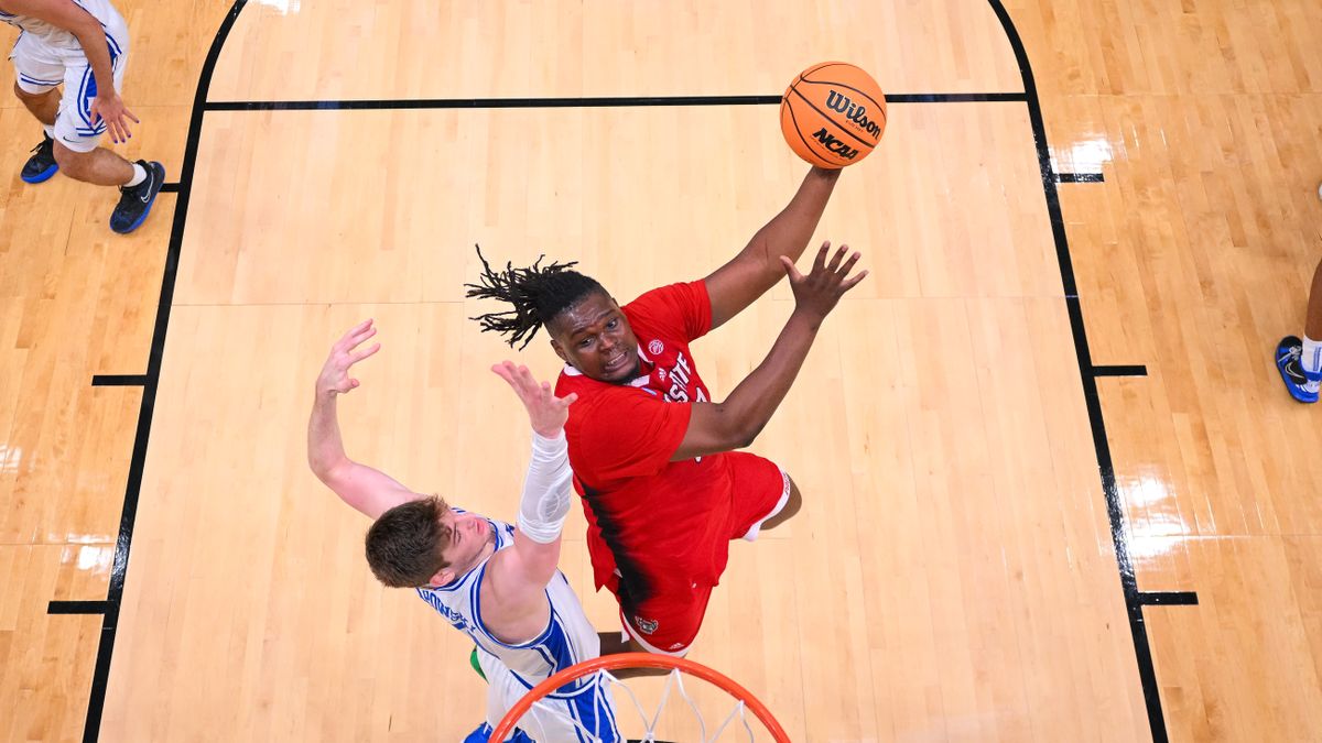 DJ Burns Jr. #30 of the North Carolina State Wolfpack scores ahead of the Men&#039;s Final Four 2024 games at March Madness.