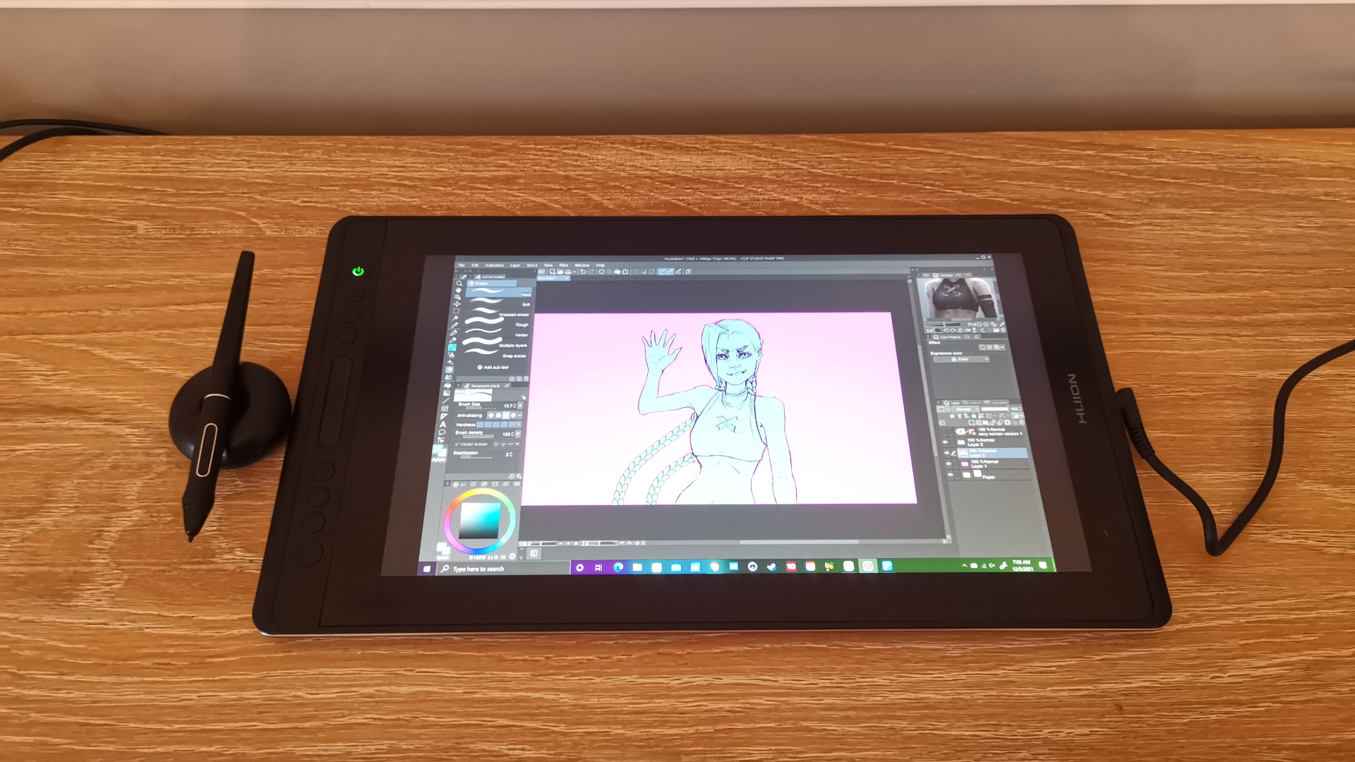 The Huion Kamvas Pro 16 laying flat on a side table