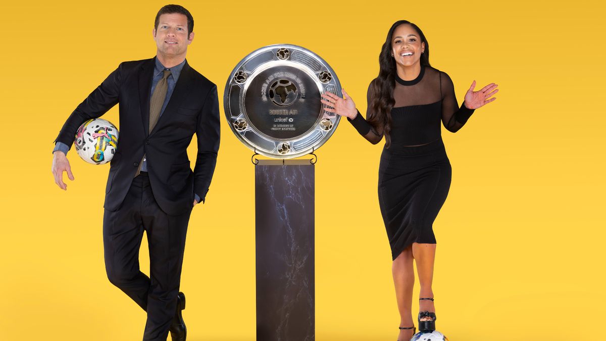 Dermot O&#039;Leary and Alex Scott pose with footballs and the trophy for Soccer Aid 2023