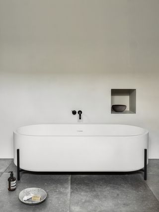 minimalist bathroom with modern round bath tub