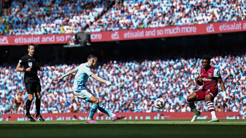 Phil Foden of Manchester City scores a goal to make it 1-0 during the Premier League match between Manchester City and West Ham United at Etihad Stadium on May 19, 2024 in Manchester, England.