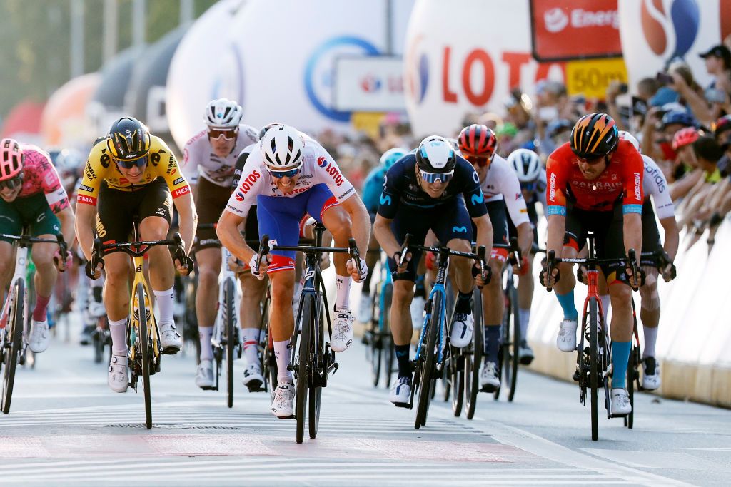 KRAKOW POLAND AUGUST 05 Olav Kooij of Netherlands and Team Jumbo Visma Arnaud Demare of France and Team Groupama FDJ White Sprint Jersey and Phil Bauhaus of Germany and Team Bahrain Victorious sprint to win during the 79th Tour de Pologne 2022 Stage 7 a 1778km stage from Valsir to Krakow TdP22 WorldTour on August 05 2022 in Krakow Poland Photo by Bas CzerwinskiGetty Images