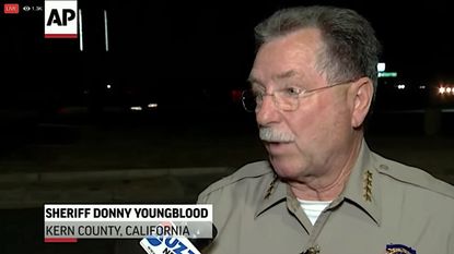 Kern County Sheriff Donny Youngblood talks to reporters