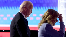 Joe Biden, accompanied by his wife, walks off stage following his televised CNN debate against Donald Trump