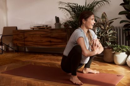 Yoga poses: Annie Clark stretches her hips