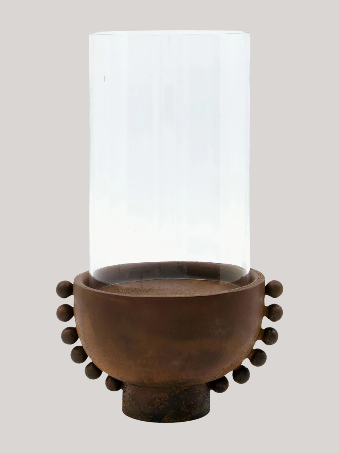 A brown candle holder with a glass top