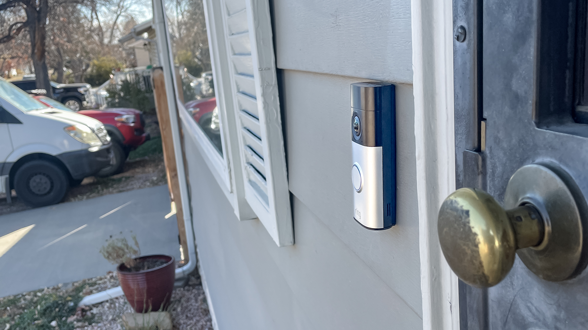 Ring Wired Doorbell Plus (2nd gen) mounted next to a front door