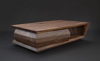 Coffee table in a geometric shape, made from dark wood