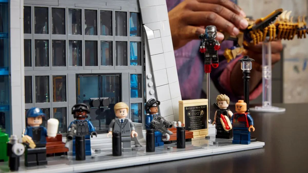 A crowd of minifigures outside the front door of Lego Avengers Tower