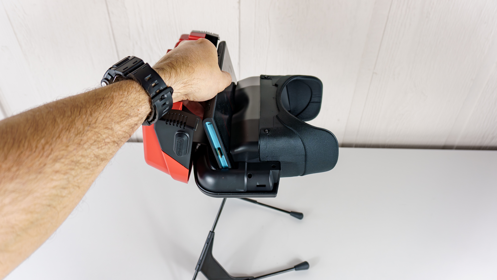 A person slotting their Switch 2 into Nintendo's new Virtual Boy accessory