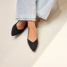 woman wearing Rothy's The Point II flats in black