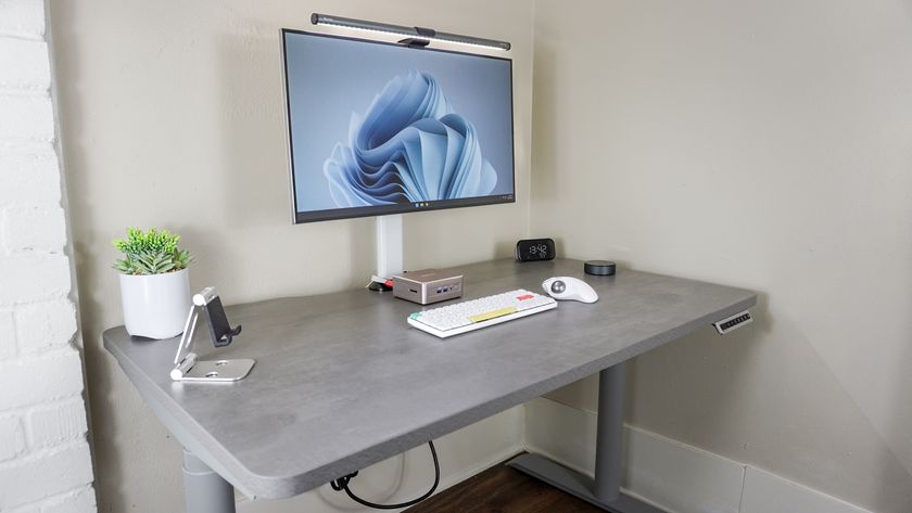 A desk setup built around the Geekom A5 mini PC using the Hinomi S1 standing desk