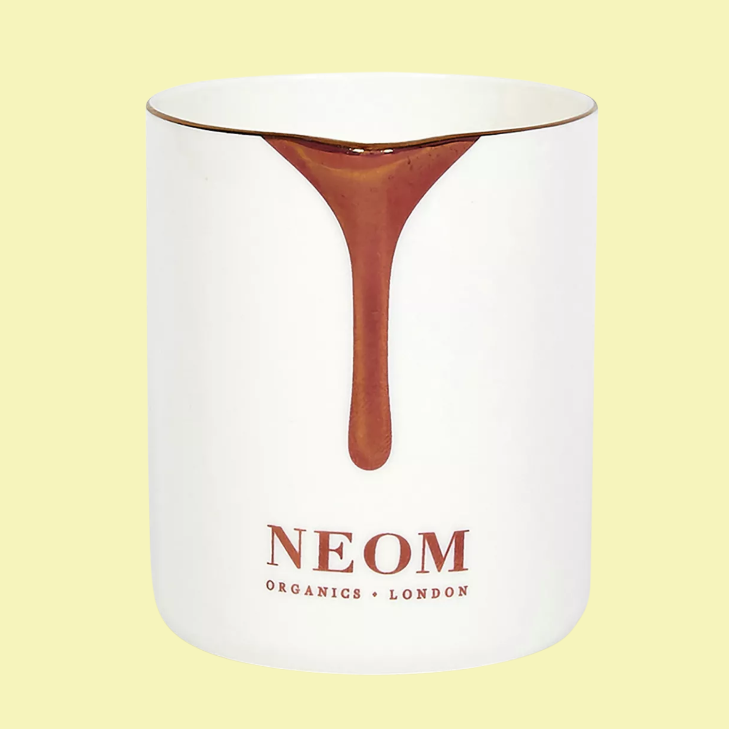 A white ceramic massage candle