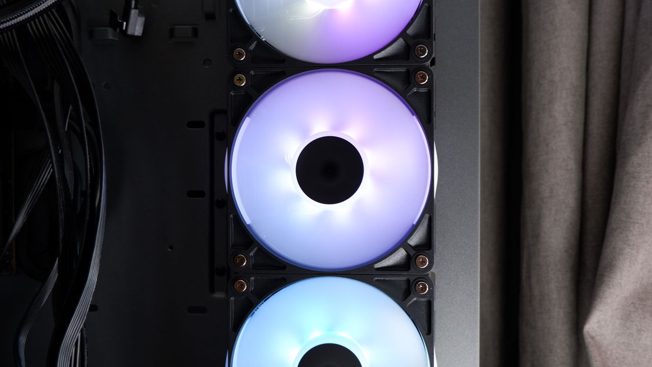 Corsair iCUE Link Titan 360 RX LCD liquid cooler set up on a test bench.