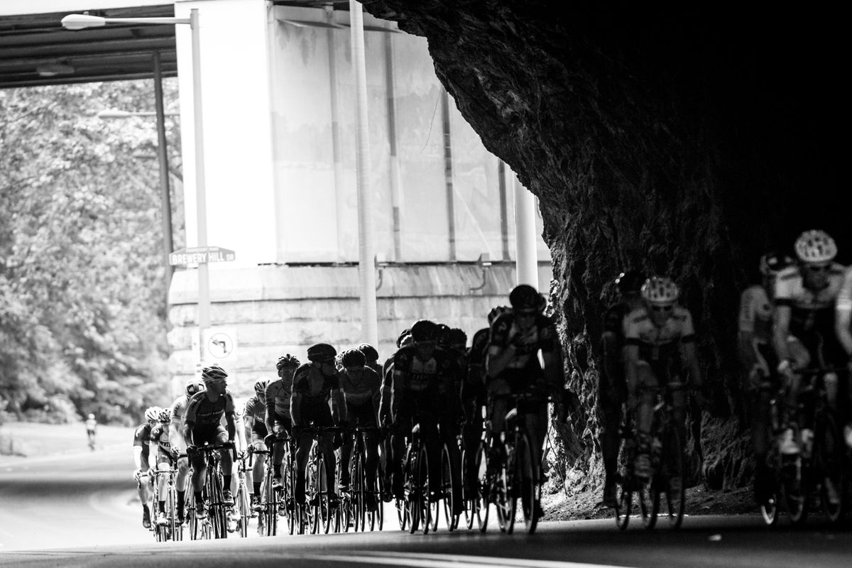 The men pass under one of the old bridges along the route