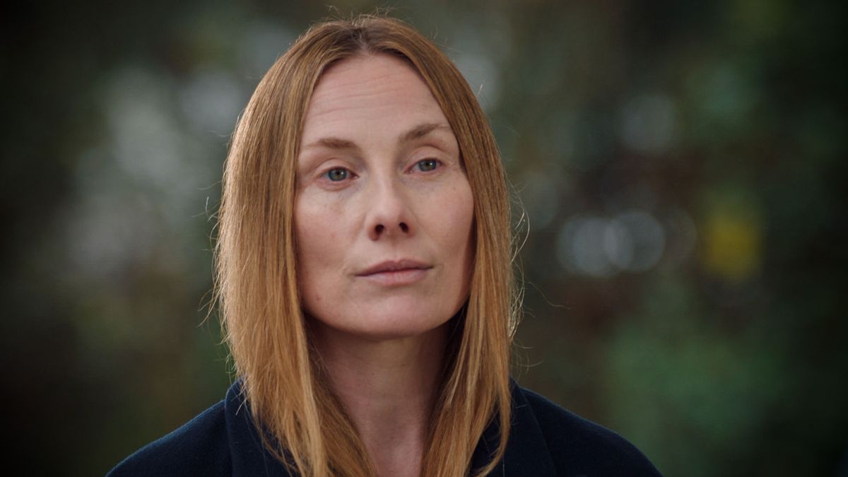 Holby City icon Jac Naylor outside the hospital looking sad.