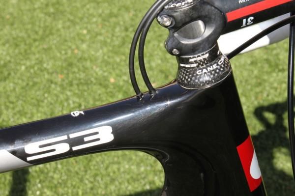 The S3 has a revised cable routing through the top of the top tube; cable housing stops there and the cables run through nylon lined stainless steel tubes to their exit points.