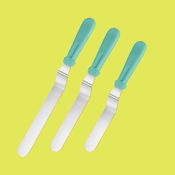 Three angled palette knives in silver with seagreen handles sit against an ochre background.