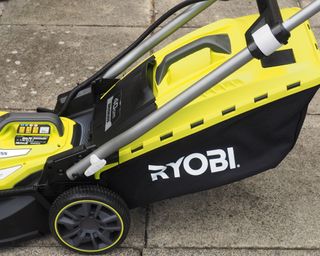 Ryobi 40cm Cordless Brushless Lawn Mower in use