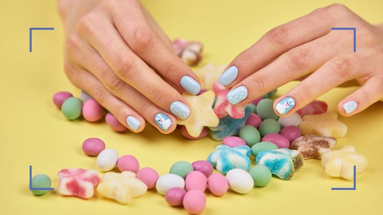 Easter nails with bunnies and dots on model