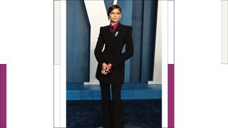 Zendaya wears a suit as she attends the 2022 Vanity Fair Oscar Party hosted by Radhika Jones at Wallis Annenberg Center for the Performing Arts on March 27, 2022 in Beverly Hills, California