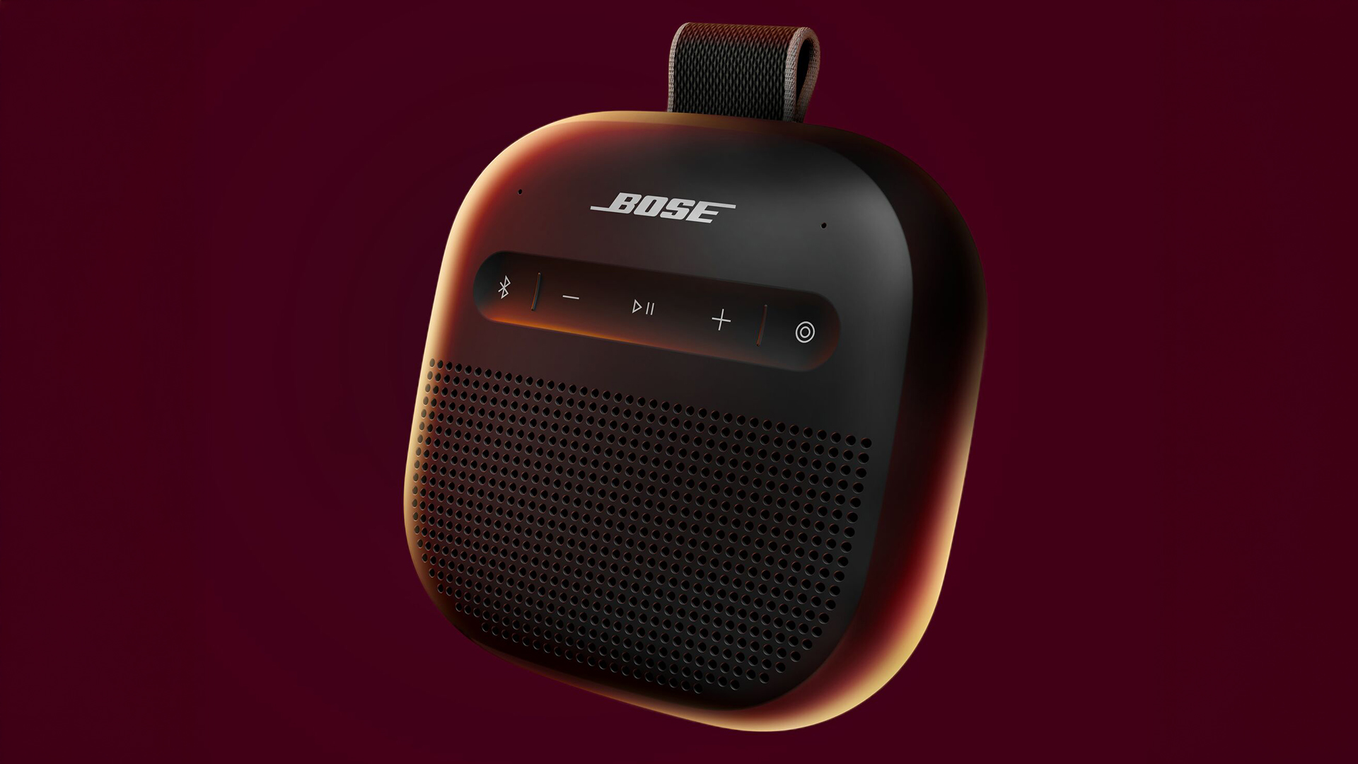 Bose SoundLink Mirco (2nd Gen) in black on a deep red background