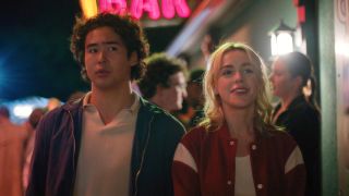 From left to right: Nico Hiraga looking confused and Kiernan Shipka smiling.