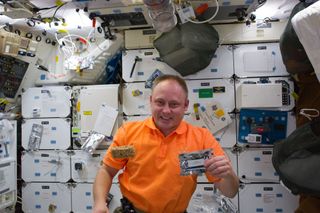 NASA has named astronaut Michael Fincke, shown here on the space shuttle Endeavour in 2011, as a replacement crewmember on the first crewed test flight of Boeing's Starliner CST-100 spacecraft later this year. He replaces astronaut Eric Boe, who will not fly for medical reasons, NASA said.