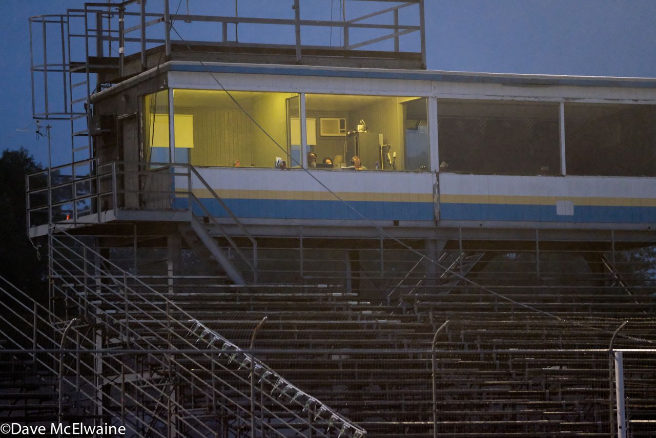 The cyclocross announcers were positioned in the box used to call motorsports races high above the racetrack