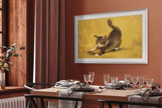 Samsung The Frame TV showing cat artwork in a living room setting