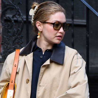 Gigi Hadid wore a New York City It-girl's uniform: a navy polo, barn jacket, jeans and the soft leather loafers trend