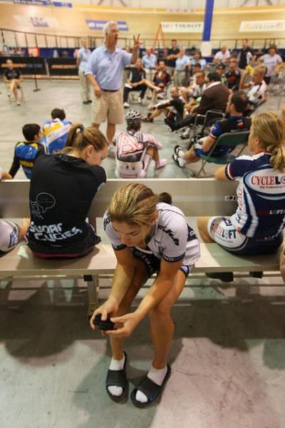 Riders show varying level of attentiveness to the pre-race meeting.