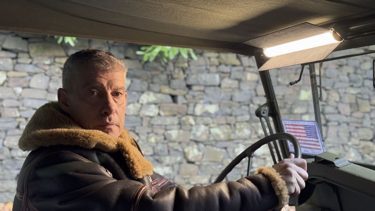 A man in an old army jeep lit by the Harlowe Blade 5 &amp; 10 LED Lighting Kit