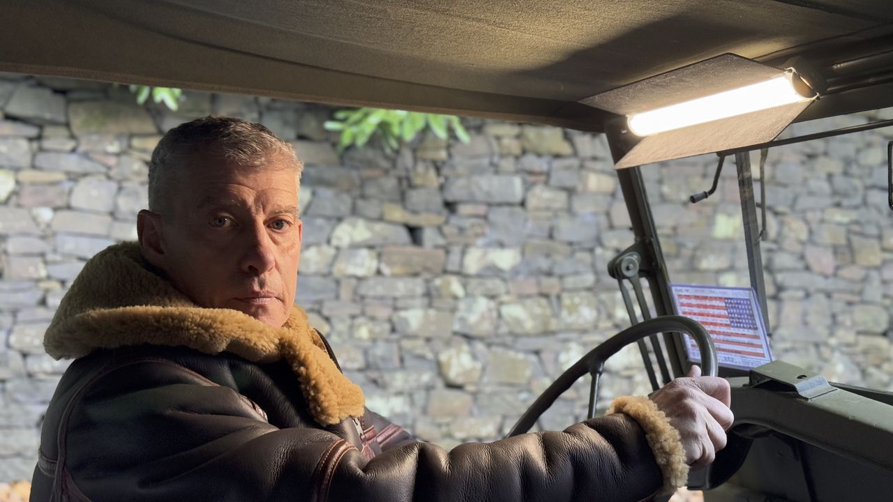 A man in an old army jeep lit by the Harlowe Blade 5 &amp; 10 LED Lighting Kit