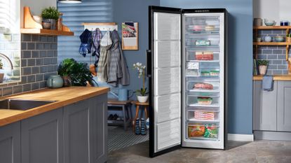 Best freezers, image shows tall freezer in a kitchen