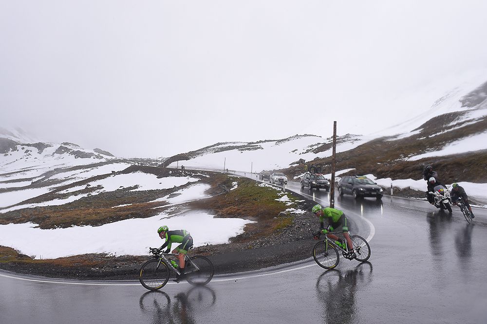 Andrew Talansky and Joe Dombroswki negotiate the slippery descent during stage 9 at the Tour de Suisse