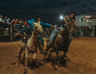 Ivan McClellan photograph of two men at the rodeo