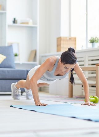 woman doing Press-ups at home