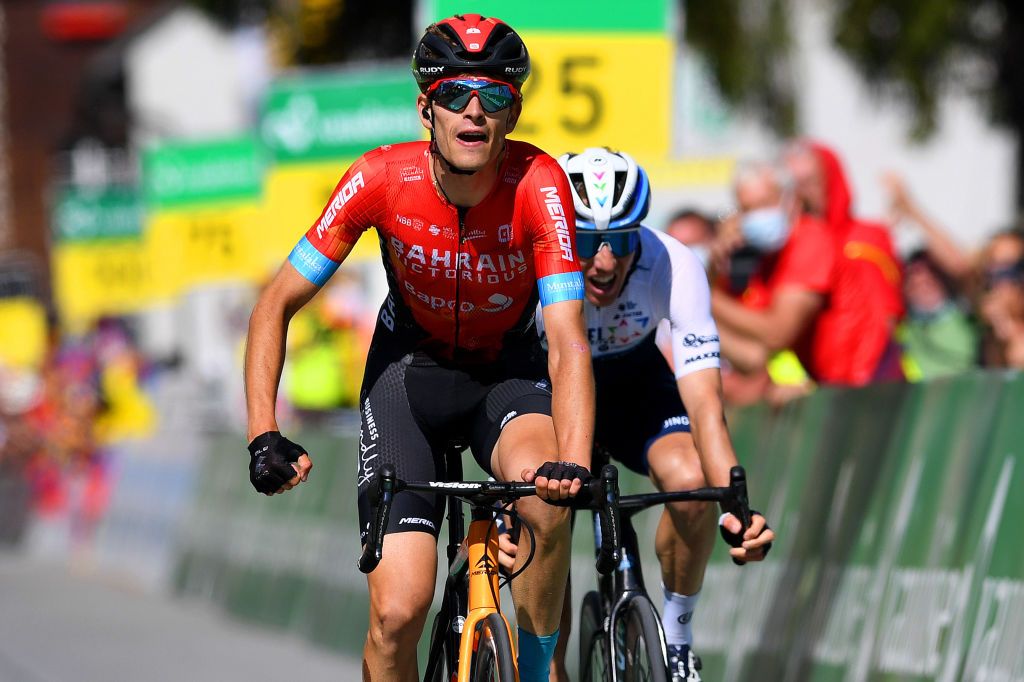 ANDERMATT SWITZERLAND JUNE 13 Gino Mder of Switzerland and Team Bahrain Victorious stage winner celebrates at arrival Michael Woods of Canada and Team Israel StartUp Nation during the 84th Tour de Suisse 2021 Stage 8 a 1595km stage from Andermatt to Andermatt UCIworldtour tds tourdesuisse on June 13 2021 in Andermatt Switzerland Photo by Tim de WaeleGetty Images