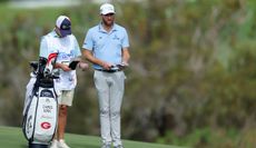 Chris Kirk speaks to his caddie during The Sentry