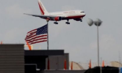 A plane reportedly carrying Russians convicted for spying for the West lands at Dulles airport.